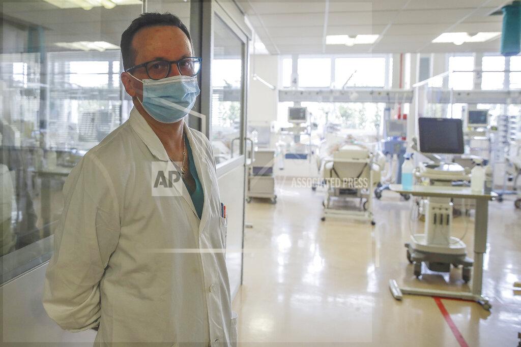 Luca Bruno Luca Cabrini, Director of the Intensive Care Unit of Varese’s Circolo Hospital, stands outside the intensive care unit, in Varese, Italy, Friday, Nov. 6, 2020. During Italy's autumn pandemic resurgence, concern is falling less on intensive care wards and more on regular medical wards, as eight regions have seen the needle move alarmingly into the red-alert zone with more than half of hospital beds dedicated to coronavirus patients. (AP Photo/Luca Bruno)