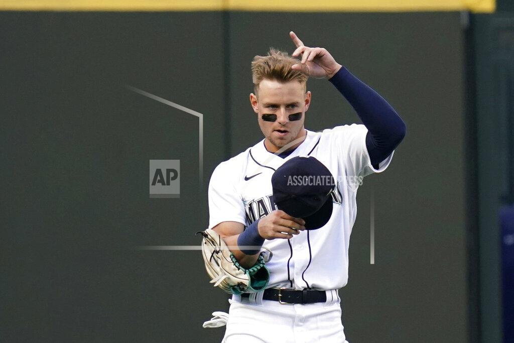 Elaine Thompson Seattle Mariners left fielder Jarred Kelenic acknowledges fans as he takes his place on the field in the first inning of a baseball game Thursday, May 13, 2021, in Seattle. The game was Kelenic's major league debut. (AP Photo/Elaine Thompson)