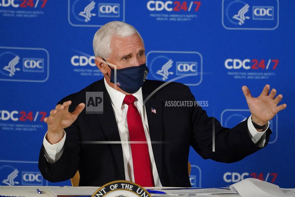 John Bazemore Vice President Mike Pence speaks during a briefing on COVID-19 at the Centers for Disease Control and Prevention Friday, Dec. 4, 2020, in Atlanta. (AP Photo/John Bazemore)