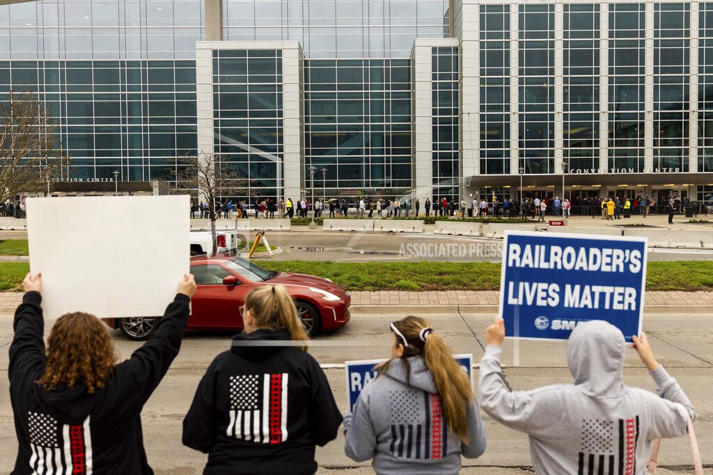 Anna Reed People protest outside the Berkshire Hathaway 2022 Annual Shareholders Meeting over the ongoing contract negotiations for BNSF Railway union workers outside the CHI Health Center in Omaha, Neb., on Saturday, April 30, 2022. (Anna Reed/Omaha World-Herald via AP)