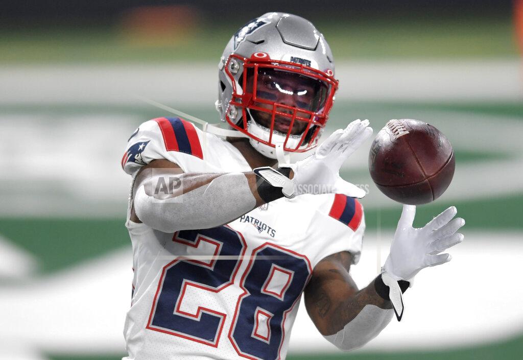 Bill Kostroun FILE - In this Monday, Nov. 9, 2020 file photo, New England Patriots running back James White (28) warms up before an NFL football game against the New York Jets in East Rutherford, N.J. For James White, the upcoming 2021 NFL season is all about starting fresh, both on and off the field. It was just this past September that the veteran Patriots running back was blindsided hours before New England’s second game of the season with news of a horrific car accident in Florida that killed his father and critically injured his mother. (AP Photo/Bill Kostroun, File)