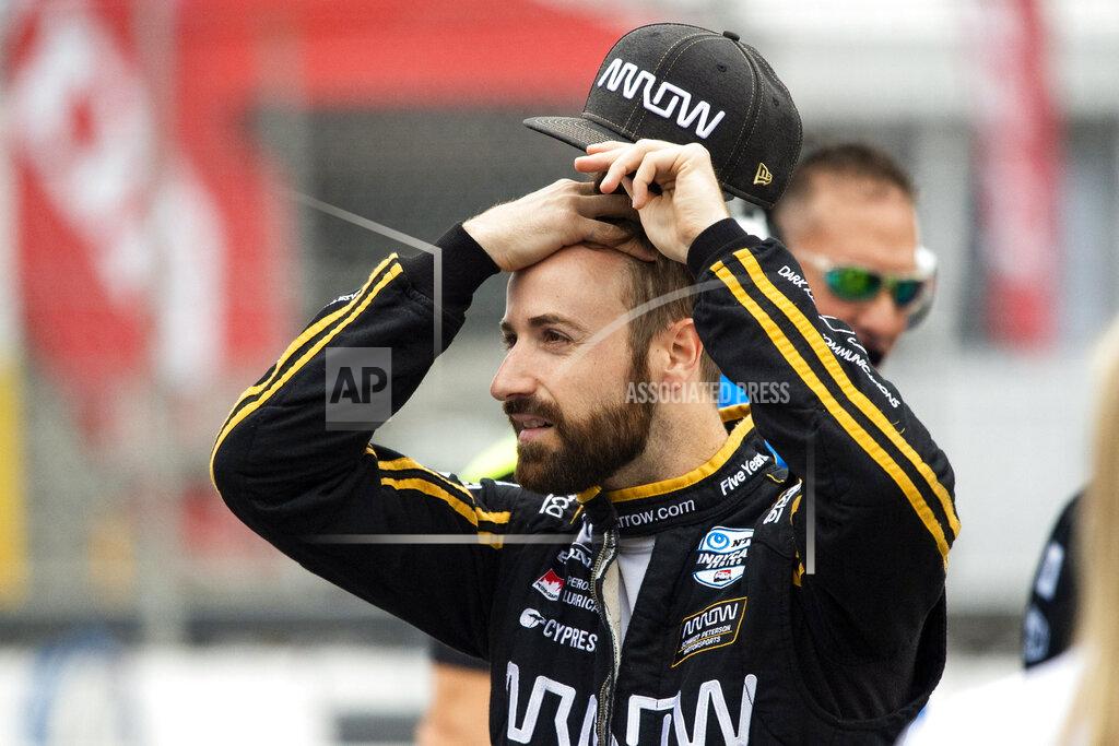 Andrew Lahodynskyj FILE - In this July 12, 2019, file photo, Canadian race car driver James Hinchcliffe gets ready to take part in the first of two practice sessions at the IndyCar auto race in Toronto. Sebastien Bourdais spent a day in early November helping IndyCar fine-tune its newest safety innovation. Later that night, he learned he was likely losing his job with a year remaining on his contract. The four-time series champion joined James Hinchcliffe as veterans abruptly dumped from their rides as IndyCar is shifting toward younger, cheaper drivers. (Andrew Lahodynskyj/The Canadian Press via AP, File)