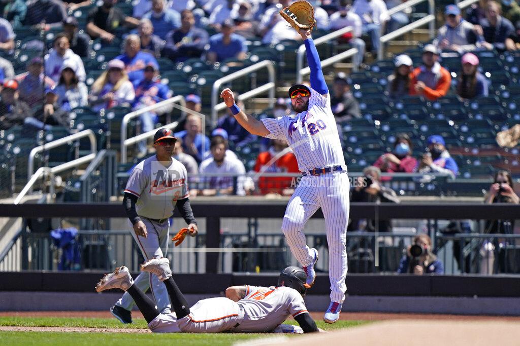 Kathy Willens New York Mets first baseman Pete Alonso (20) reaches for a high throw as Baltimore Orioles' Rio Ruiz dives back to first during the second inning of a baseball game, Wednesday, May 12, 2021, in New York. (AP Photo/Kathy Willens)