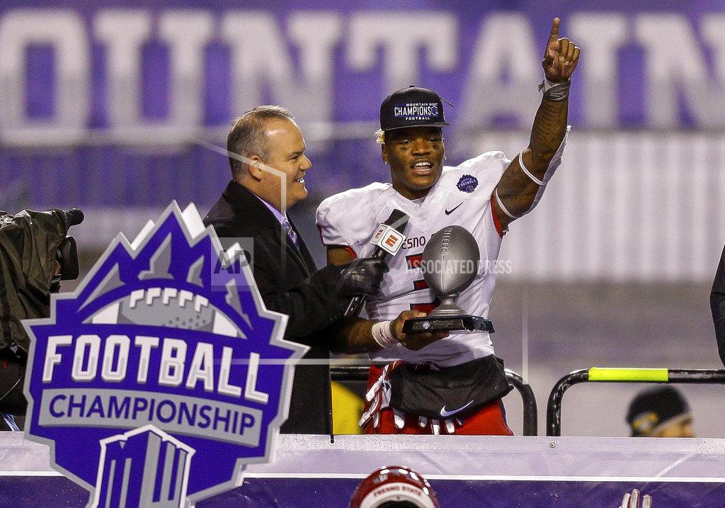 Steve Conner Fresno State defensive end Mykal Walker receives the Defensive Player of the Game award after the team's NCAA college football game against Boise State for the Mountain West championship, Saturday, Dec. 1, 2018, in Boise, Idaho. Fresno State won 19-16. (AP Photo/Steve Conner)