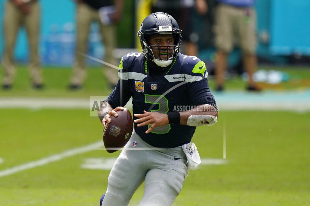 Wilfredo Lee Seattle Seahawks quarterback Russell Wilson (3) looks to pass the ball during the first half of an NFL football game against the Miami Dolphins, Sunday, Oct. 4, 2020 in Miami Gardens, Fla. (AP Photo/Wilfredo Lee)