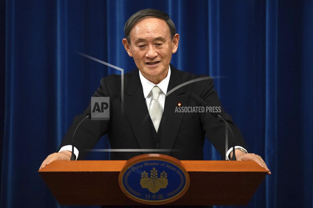 Carl Court FILE - In this Sept. 16, 2020, file photo, Japan's new Prime Minister Yoshihide Suga speaks during a press conference at the prime minister's official residence in Tokyo, Japan. Japan's new Prime Minister Suga heads to Vietnam and Indonesia on Sunday, Oct. 18, 2020, on his first overseas foray since taking over from his former boss Shinzo Abe last month. (Carl Court/Pool Photo via AP, File)