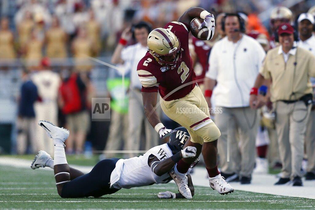 Michael Dwyer Wake Forest defensive back Nasir Greer, bottom, stops Boston College running back AJ Dillon (2) on the carry during the first half of an NCAA college football game in Boston, Saturday, Sept. 28, 2019. (AP Photo/Michael Dwyer)