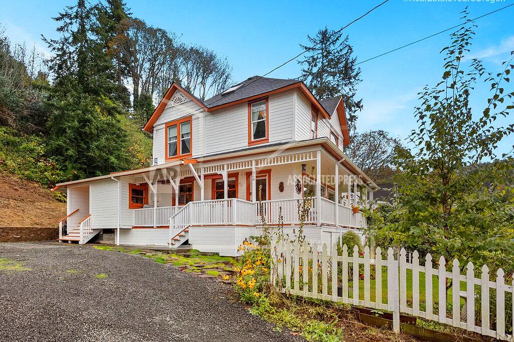 Uncredited In this undated photo provided by RETO Media is the house featured in the Steven Spielberg film "The Goonies" in Astoria, Ore. The Victorian home, built in 1896 with sweeping views of the Columbia River as it flows into the Pacific Ocean, is now for sale has been listed with an asking price of $1.7 million. Since the film was released in 1985, fans have flocked to the home, and the owner has long complained of constant crowds and trespassing. (RETO Media via AP)