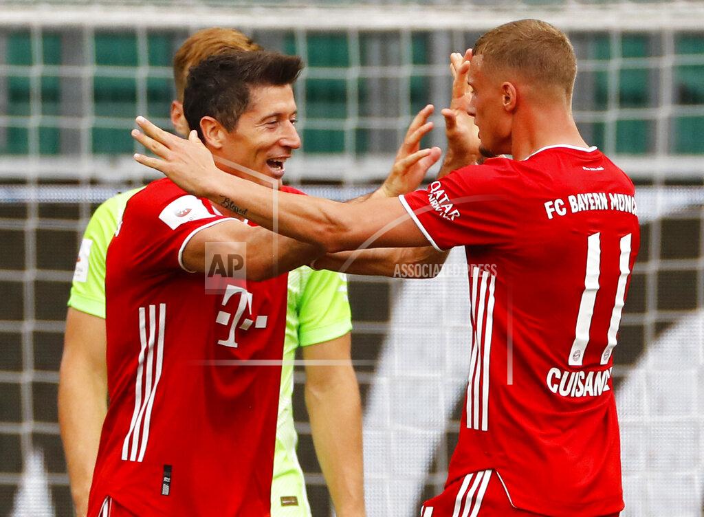 Kai Pfaffenbach Munich's scorer Mickael Cuisance, right, and his teammate Robert Lewandowski celebrate their side's second goal with during the German Bundesliga soccer match between VfL Wolfsburg and FC Bayern Munich in Wolfsburg, Germany, Saturday, June 27, 2020. (Kai Pfaffenbach/Pool Photo via AP)