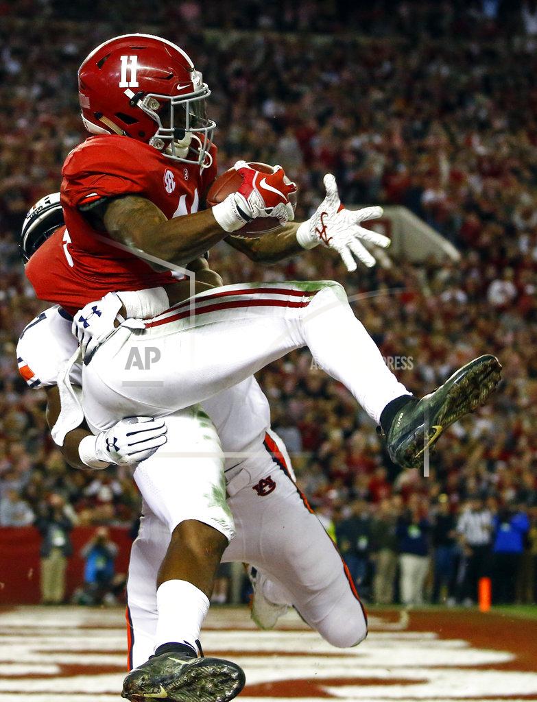 Butch Dill Alabama wide receiver Henry Ruggs III (11) catches a pass over Auburn defensive back Roger McCreary (17) for a touchdown during the second half of an NCAA college football game, Saturday, Nov. 24, 2018, in Tuscaloosa, Ala. (AP Photo/Butch Dill)