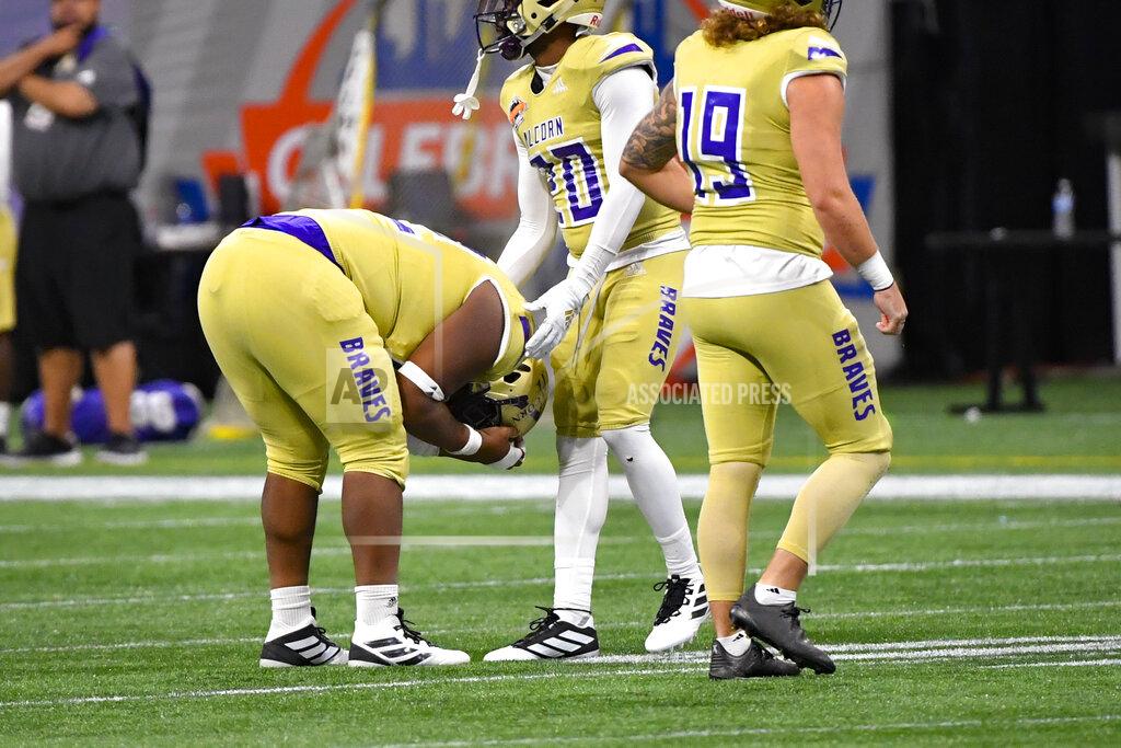 John Amis Alcorn State defensive lineman Kee Wayne Jones is consoled by defensive back Allen Bruce (20) after North Carolina A&T scored a touchdown during the second half of the Celebration Bowl NCAA college football game, Saturday, Dec. 21, 2019, in Atlanta. North Carolina A&T won 64-44. (John Amis/Atlanta Journal-Constitution via AP)