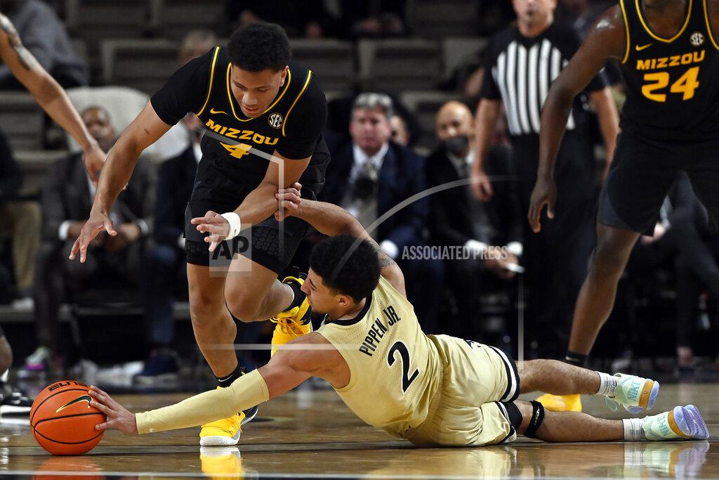 Mark Zaleski Vanderbilt guard Scotty Pippen Jr. (2) reaches for the ball after Missouri guard Javon Pickett (4) knocked it out of the hands of Pippen during the second half of an NCAA college basketball game Tuesday, Feb. 8, 2022, in Nashville, Tenn. Vanderbilt won 70-62. (AP Photo/Mark Zaleski)