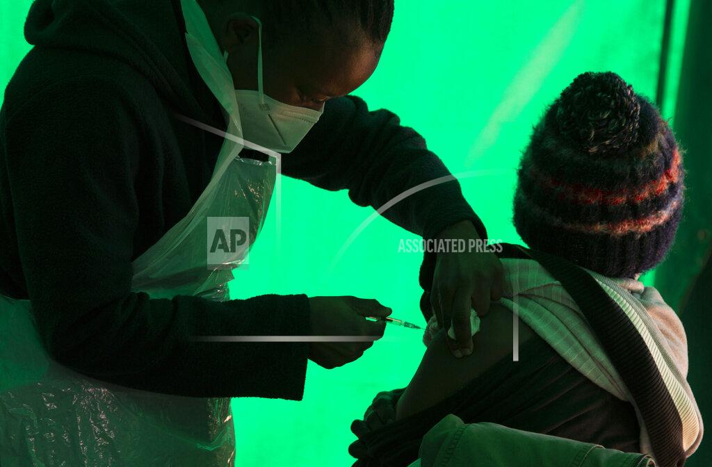 Denis Farrell FILE - In this June 3, 2021 file photo an elderly patient receives a dose of the Pfizer COVID-19 vaccine, at a clinic at Orange Farm, near Johannesburg, South Africa. African health officials and the United Nations warned Thursday, Oct. 28, 2021 of a looming shortage of up to 2 billion syringes for mainly low- and middle-income countries around the world. (AP Photo/Denis Farrell, File)