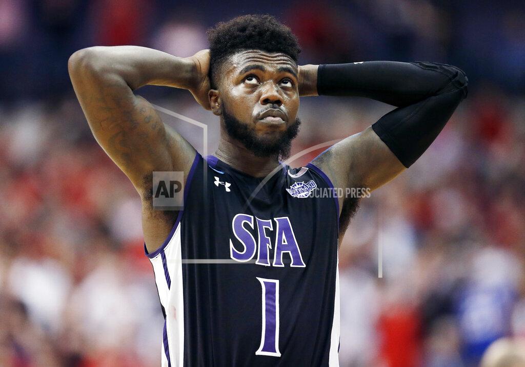 Brandon Wade FILE - In this Thursday, March 15, 2018, file photo, Stephen F. Austin guard Kevon Harris (1) reacts after losing to Texas Tech during the first-round game at the NCAA college basketball tournament in Dallas. The rule adopted by the NCAA amid the college basketball scandal and that is designed to help players explore their pro potential and still return to school surprisingly applies only to Division I players. An agent helped Harris get feedback on his game before he withdrew from the draft to return to school. (AP Photo/Brandon Wade, File)