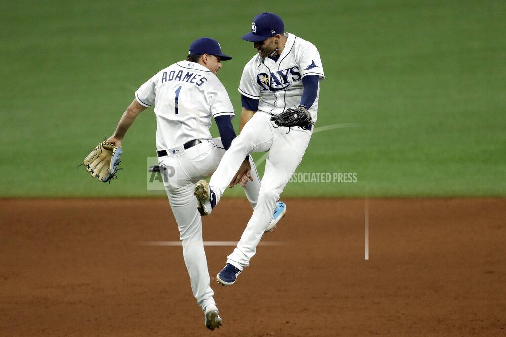 Chris O'meara Tampa Bay Rays center fielder Kevin Kiermaier and shortstop Willy Adames (1) celebrate after the team defeated the New York Yankees during a baseball game Friday, Aug. 7, 2020, in St. Petersburg, Fla. (AP Photo/Chris O'Meara)