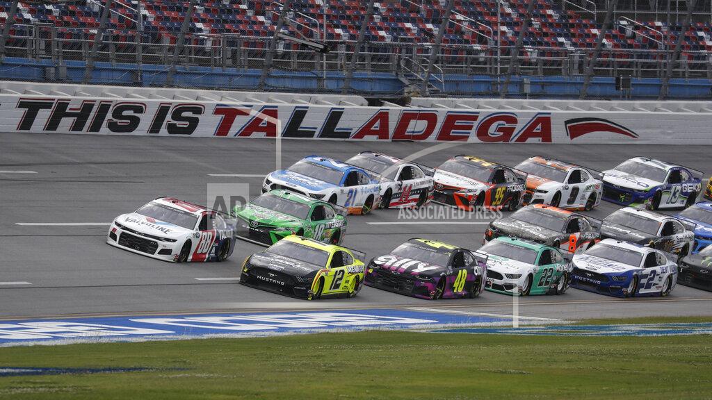 John Bazemore Ryan Blaney (12) takes the inside line during a restart of a NASCAR Cup Series auto race at Talladega Superspeedway in Talladega Ala., Monday, June 22, 2020. (AP Photo/John Bazemore)