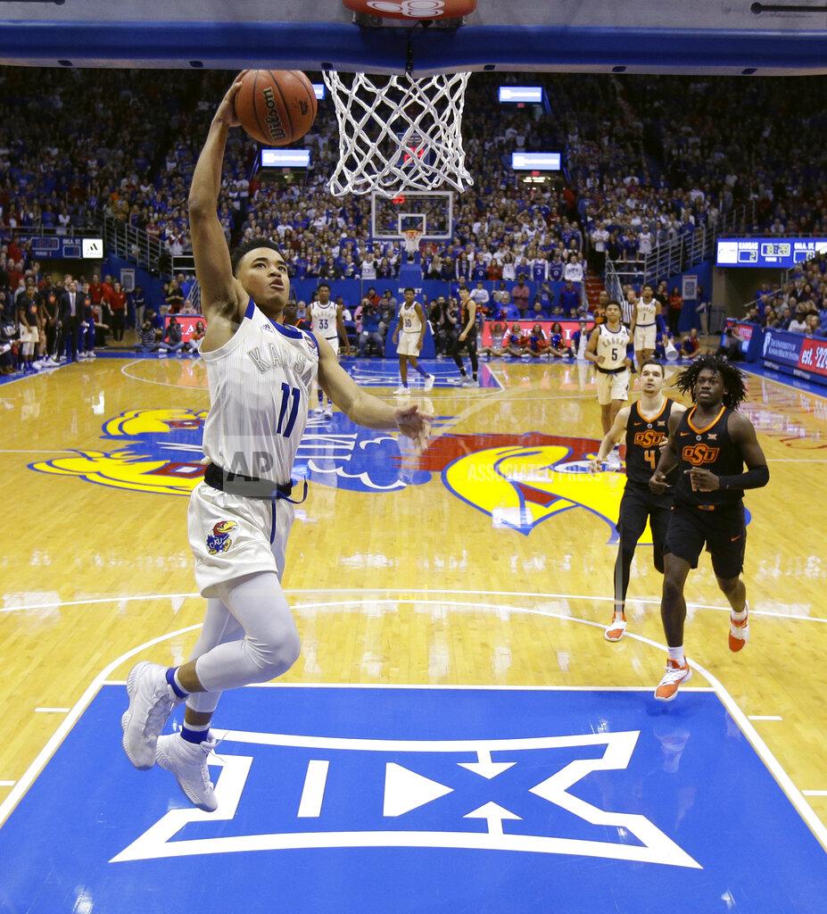 Charlie Riedel Kansas' Devon Dotson (11) puts up a shot during the first half of an NCAA college basketball game against Oklahoma State Saturday, Feb. 9, 2019, in Lawrence, Kan. (AP Photo/Charlie Riedel)