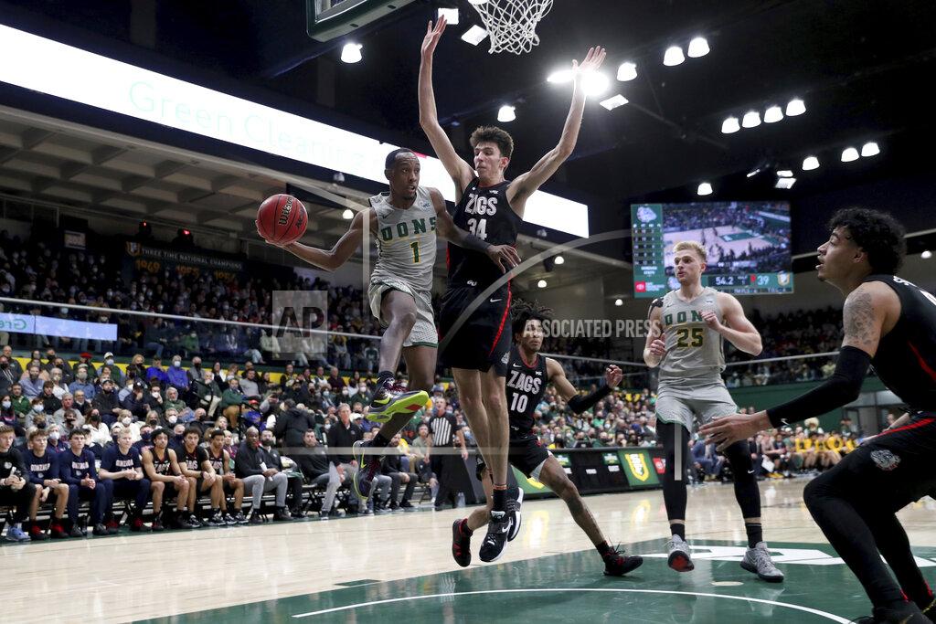 Jed Jacobsohn San Francisco guard Jamaree Bouyea (1) looks to pass against Gonzaga center Chet Holmgren (34) during the first half of an NCAA college basketball game in San Francisco, Calif., Thursday, Feb. 24, 2022. (AP Photo/Jed Jacobsohn)
