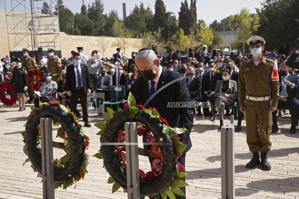 Maya Alleruzzo Israeli Prime Minister Benjamin Netanyahu lays a wreath at a ceremony marking the annual Holocaust Remembrance Day, at Yad Vashem Holocaust Memorial in Jerusalem, Thursday, April 8, 2021. (AP Photo/Maya Alleruzzo, Pool)