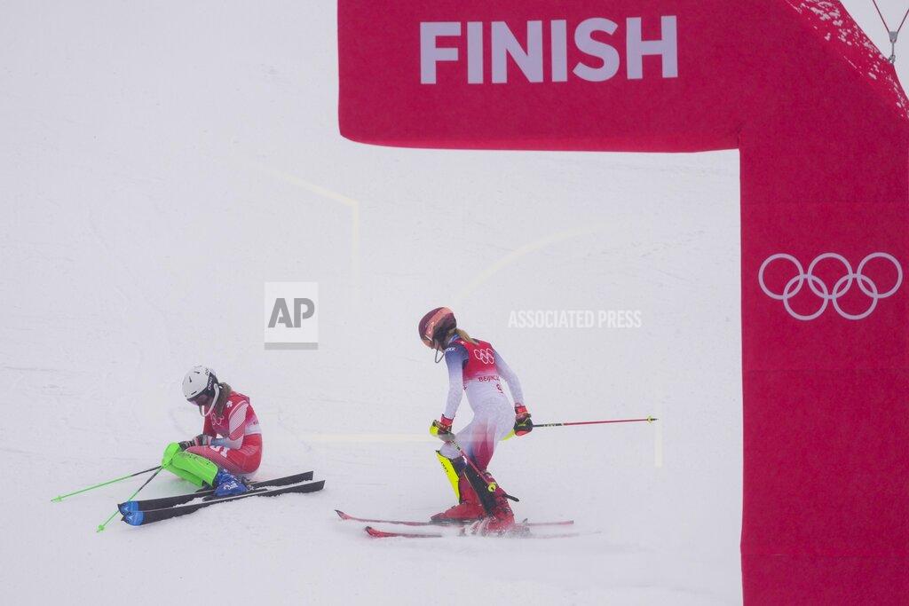 Mark Schiefelbein Mikaela Shiffrin, of the United States, right, talks to Priska Nufer, of Switzerland, as she comes down the hill after falling in the women's combined slalom at the 2022 Winter Olympics, Thursday, Feb. 17, 2022, in the Yanqing district of Beijing. (AP Photo/Mark Schiefelbein)