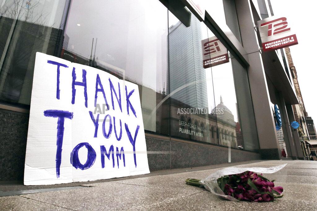 Charles Krupa A bouquet of flowers and a sign thanking former New England Patriots quarterback Tom Brady, who announced he was leaving the football team, rest on the sidewalk outside the TB12 training center in Boston, Tuesday, March 17, 2020. (AP Photo/Charles Krupa)