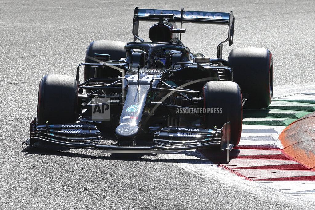 Matteo Bazzi Mercedes driver Lewis Hamilton of Britain steers his car during the qualifying session at the Monza racetrack in Monza, Italy, Saturday, Sept.5, 2020. The Italian Formula One Grand Prix will be held on Sunday. (Matteo Bazzi, Pool via AP)