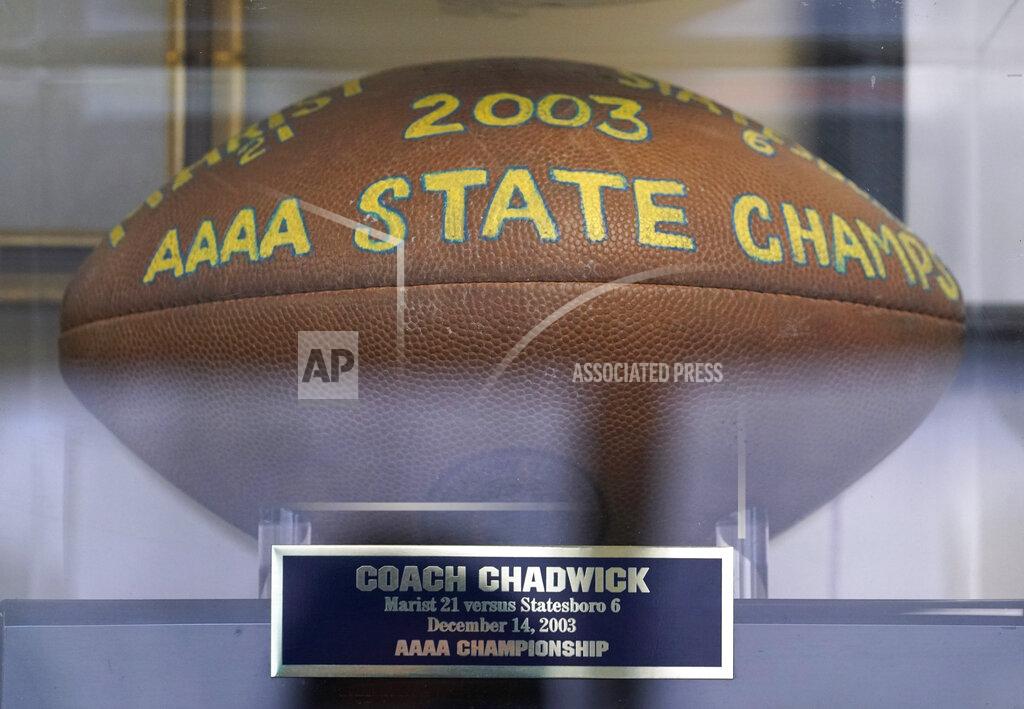David J. Phillip A 2003 championship football is displayed in the office of Marist School football coach Alan Chadwick during an interview about Los Angeles Rams coach Sean McVay's high school career at Marist, for the NFL Super Bowl 53 football game Friday, Feb. 1, 2019, in Atlanta. McVay was the starting quarterback his senior year at Marist when the team won the state championship in 2003. (AP Photo/David J. Phillip)
