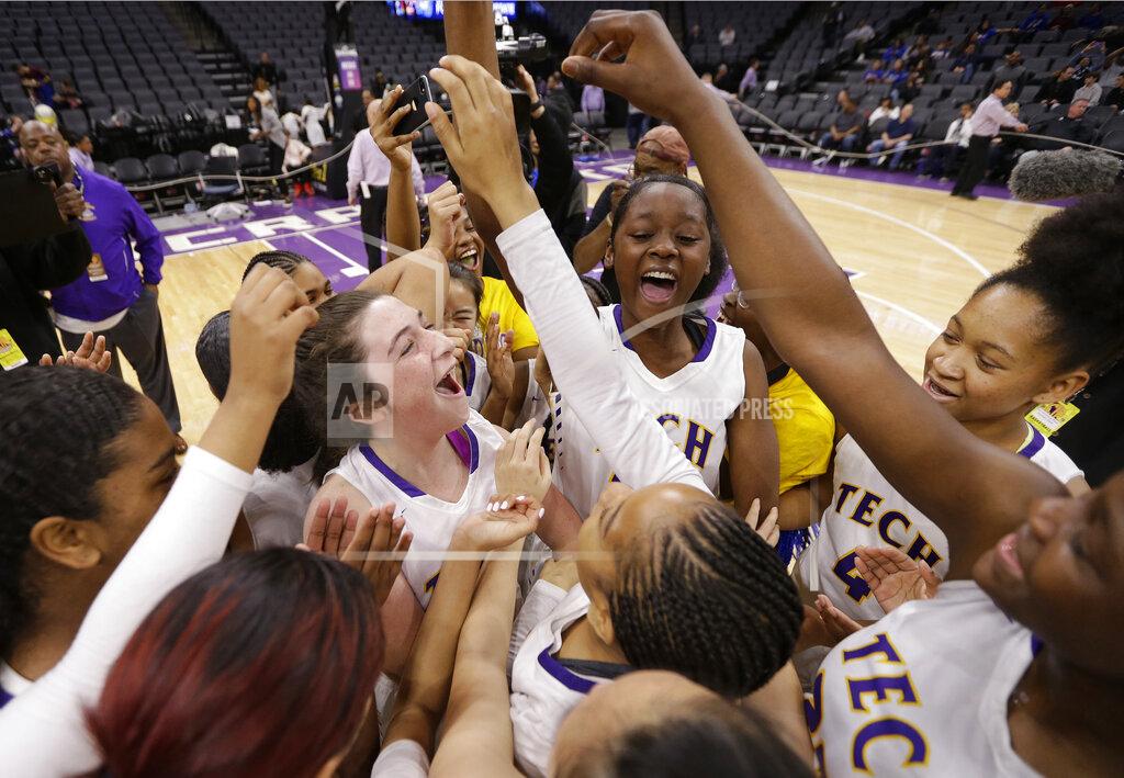 Rich Pedroncelli FILE - In this March 9, 2019, file photo, Oakland Tech players celebrate after defeating Northview High School in the CIF girls' Division IV state high school basketball championship game in Sacramento, Calif. On Thursday, March 4, 2021, lawyers representing two high school athletes say Gov. Gavin Newsom's administration has agreed to allow all indoor youth sports to resume as part of a lawsuit settlement. (AP Photo/Rich Pedroncelli, File)