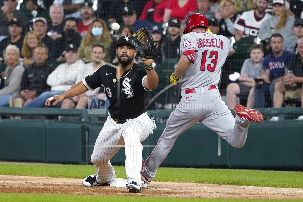 Charles Rex Arbogast Los Angeles Angels' Phil Gosselin beats the throw to Jose Abreu for an RBI infield single during the third inning of a baseball game Wednesday, Sept. 15, 2021, in Chicago. Gosselin was originally called out, but the call was overturned after video review. (AP Photo/Charles Rex Arbogast)