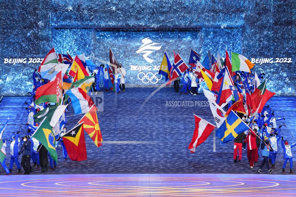 Bernat Armangue Teams arrive during the closing ceremony of the 2022 Winter Olympics, Sunday, Feb. 20, 2022, in Beijing. (AP Photo/Bernat Armangue)