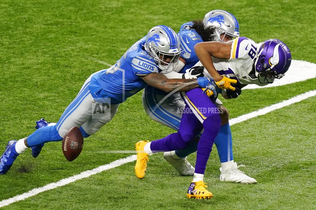Carlos Osorio Minnesota Vikings wide receiver Justin Jefferson (18) fumbles as he is tackled by Detroit Lions outside linebacker Jahlani Tavai (51) and free safety Will Harris (25) during the first half of an NFL football game, Sunday, Jan. 3, 2021, in Detroit. (AP Photo/Carlos Osorio)
