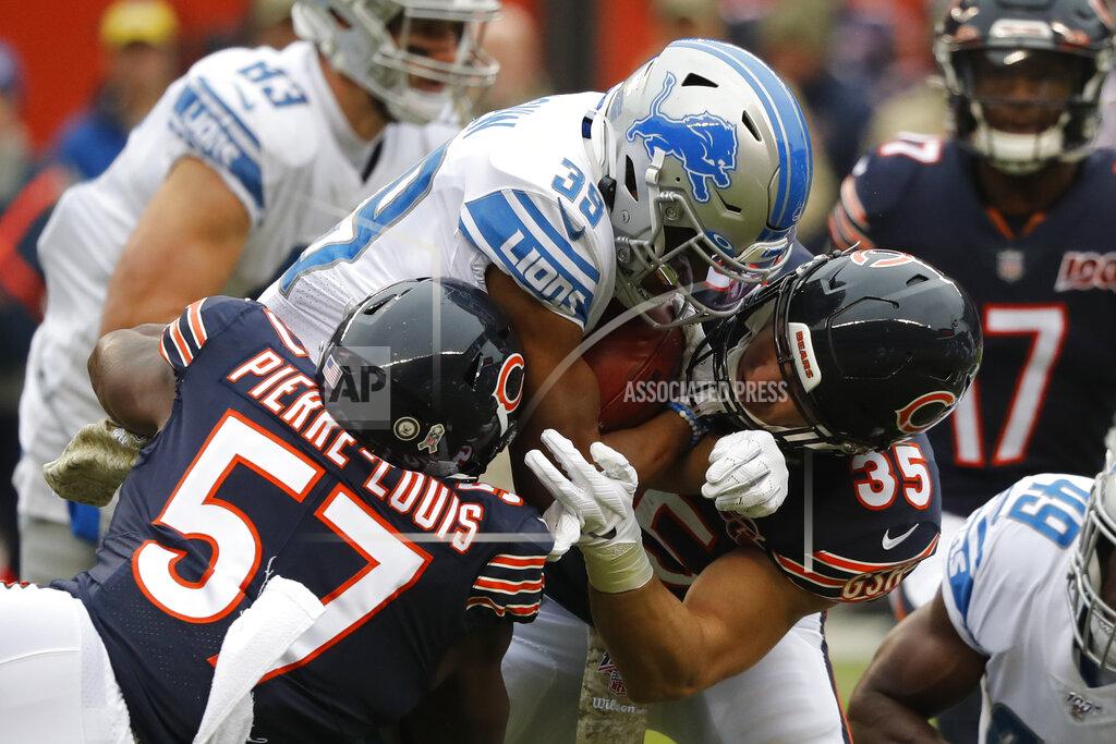 Charles Rex Arbogast Chicago Bears linebacker Kevin Pierre-Louis (57) and Ryan Nall (35) stop Detroit Lions' Jamal Agnew (39) during the first half of an NFL football game in Chicago, Sunday, Nov. 10, 2019. (AP Photo/Charles Rex Arbogast)