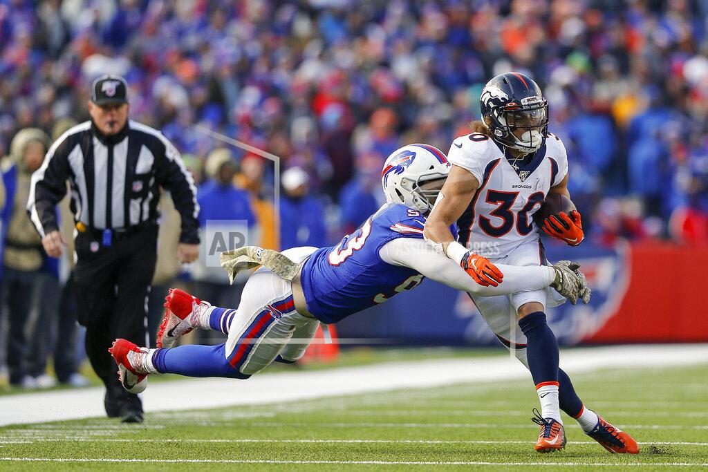 John Munson Denver Broncos running back Phillip Lindsay (30) is tackled by Buffalo Bills defensive end Trent Murphy (93) during the second quarter NFL football game, Sunday, Nov. 24, 2019, in Orchard Park, N.Y. (AP Photo/John Munson)