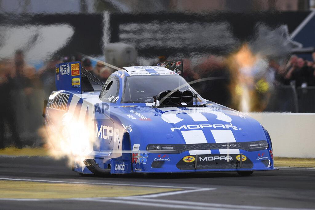 Marc Gewertz In this photo provided by the NHRA, Matt Hagan powers his Funny Car to the provisional top spot Friday, Feb. 21, 2020, at the NHRA Arizona Nationals drag races in Chandler, Ariz. (Marc Gewertz/NHRA via AP)