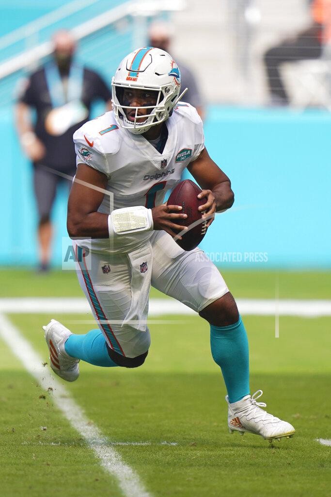 Wilfredo Lee Miami Dolphins quarterback Tua Tagovailoa (1) looks to pass the ball during the first half of an NFL football game against the Los Angeles Rams, Sunday, Nov. 1, 2020, in Miami Gardens, Fla. The L.A. Chargers play at Miami on Sunday. (AP Photo/Wilfredo Lee)