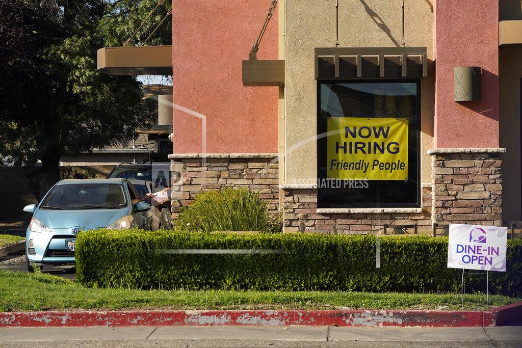 Rich Pedroncelli A hiring sign hangs in the window of a Taco Bell in Sacramento, Calif., Thursday, July 15, 2021. Hiring in California slowed down in June as the unemployment rate held steady at 7.7% according to new numbers released on Friday, July 16, 2021 by the Employment Development Department. California gained 73,000 jobs in June, ending the state's streak of four consecutive months of adding 100,000 jobs or more. But experts say the state is still struggling from a workforce shortage as California has added back just over half of the 2.7 million jobs it lost at the start of the pandemic.(AP Photo/Rich Pedroncelli))