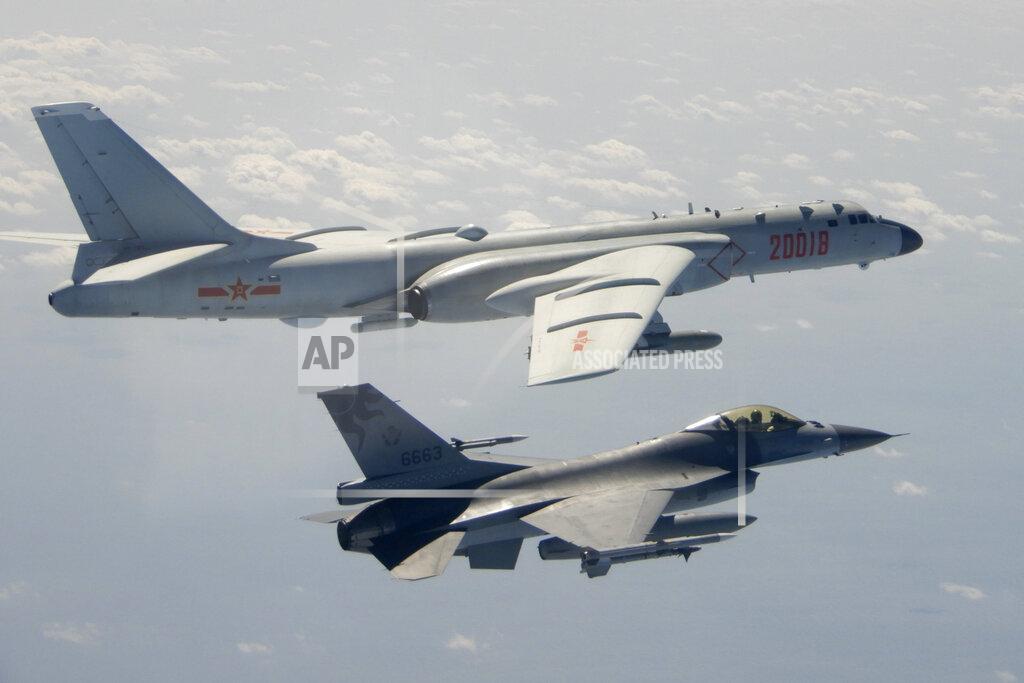 Uncredited FILE - In this Feb. 10, 2020, file photo and released by the Republic of China (ROC) Ministry of National Defense, a Taiwanese Air Force F-16 in foreground flies on the flank of a Chinese People's Liberation Army Air Force (PLAAF) H-6 bomber as it passes near Taiwan. This year's annual congress meeting comes as China and the U.S. are attempting to soften the caustic tone in relations that prevailed during the Trump administration. While President Joe Biden is maintaining pressure over trade and technology, he has shown a willingness to restore dialogue. However, China has not shown any willingness to budge in the face of U.S. support for Taiwan and criticism of Beijing's policies in Hong Kong, Tibet and Xinjiang. (Republic of China (ROC) Ministry of National Defense via AP, File)