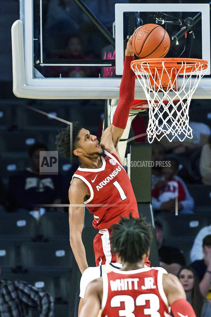 Danny Karnik Arkansas guard Isaiah Joe (1) dunks in the first half of an NCAA college basketball game against Georgia Tech Monday, Nov. 25, 2019, in Atlanta. (AP Photo/Danny Karnik)