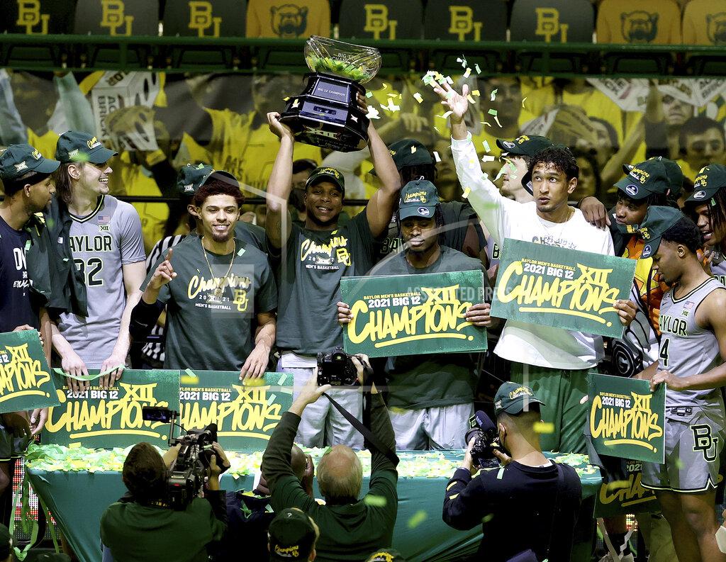 Jerry Larson Baylor players celebrate their Big 12 championship which they won against West Virginia after their NCAA college basketball game against Texas Tech Sunday, March 7, 2021, in Waco, Texas. (AP Photo/Jerry Larson)