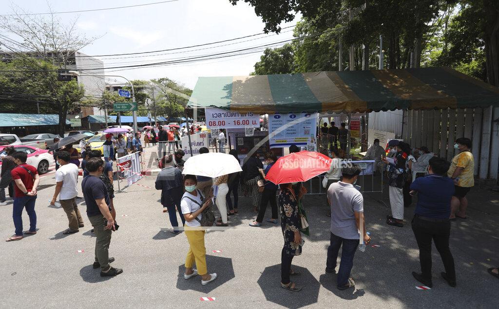 Nathatida Adireksarn FILE - In this April 23, 2021, file photo, peoples line up for a coronavirus test in Bangkok, Thailand. Developing Asian economies will grow at a solid 7.3% pace this year after contracting slightly in 2020 due to the pandemic, the Asian Development Bank says in its latest regional outlook. (AP Photo/Nathatida Adireksarn, File)