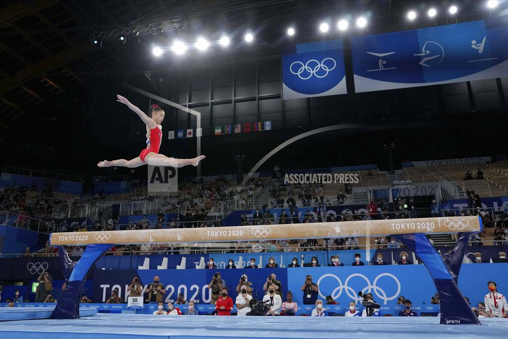 Gregory Bull Guan Chenchen, of China, performs on the balance beam during the artistic gymnastics women's apparatus final at the 2020 Summer Olympics, Tuesday, Aug. 3, 2021, in Tokyo, Japan. (AP Photo/Gregory Bull)
