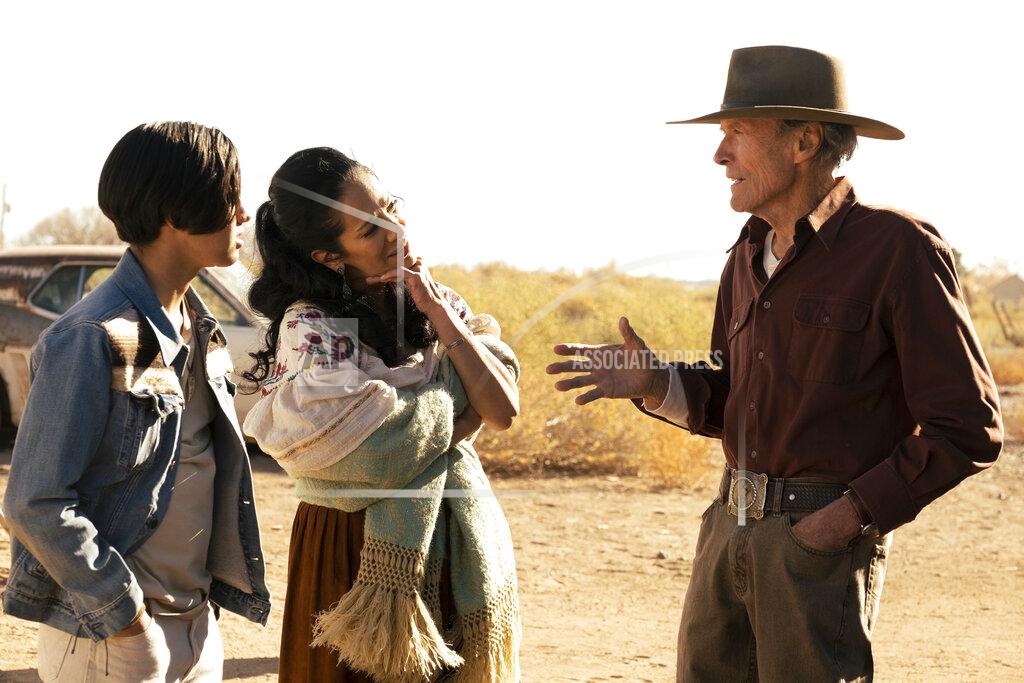 Claire Folger This image released by Warner Bros. Pictures shows Eduardo Minett, from left, Natalia Traven and Clint Eastwood in a scene from "Cry Macho." (Claire Folger/Warner Bros. Pictures via AP)