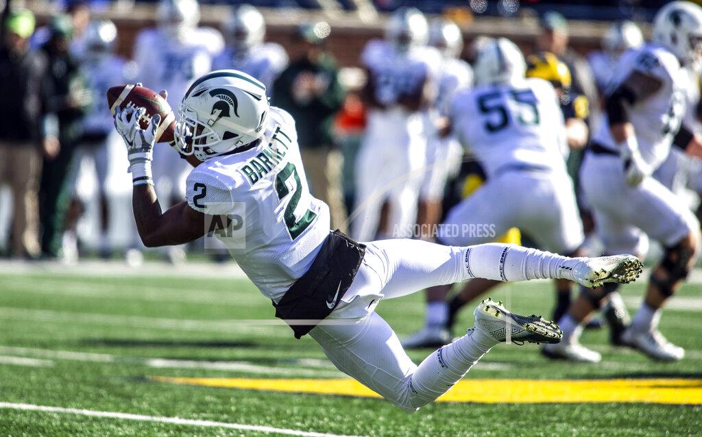 Tony Ding FILE - In this Nov. 16, 2019, file photo, Michigan State wide receiver Julian Barnett (2) makes a catch in the first quarter of an NCAA college football game against Michigan in Ann Arbor, Mich. Big Ten is going to give fall football a shot after all. Less than five weeks after pushing football and other fall sports to spring in the name of player safety during the pandemic, the conference changed course Wednesday, Sept. 16, 2020, and said it plans to begin its season the weekend of Oct. 23-24. (AP Photo/Tony Ding)