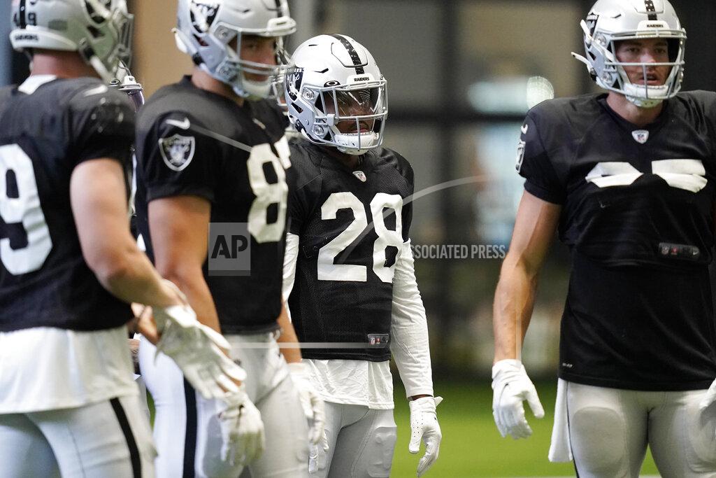 John Locher Las Vegas Raiders running back Josh Jacobs (28) attends an NFL football training camp practice Tuesday, Aug. 18, 2020, in Henderson, Nev. (AP Photo/John Locher, Pool)