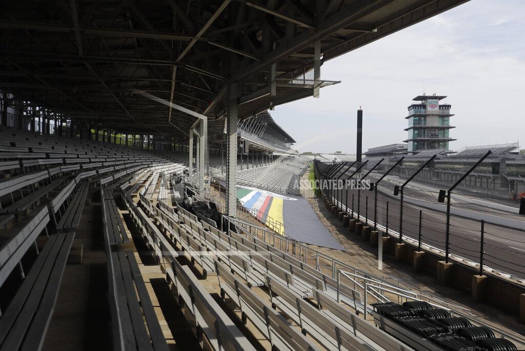 Darron Cummings Indianapolis Motor Speedway is empty, Sunday, May 24, 2020, in Indianapolis. The Indianapolis 500 was postponed because of the coronavirus pandemic. The race will instead be held Aug. 23, three months later than its May 24 scheduled date. (AP Photo/Darron Cummings)