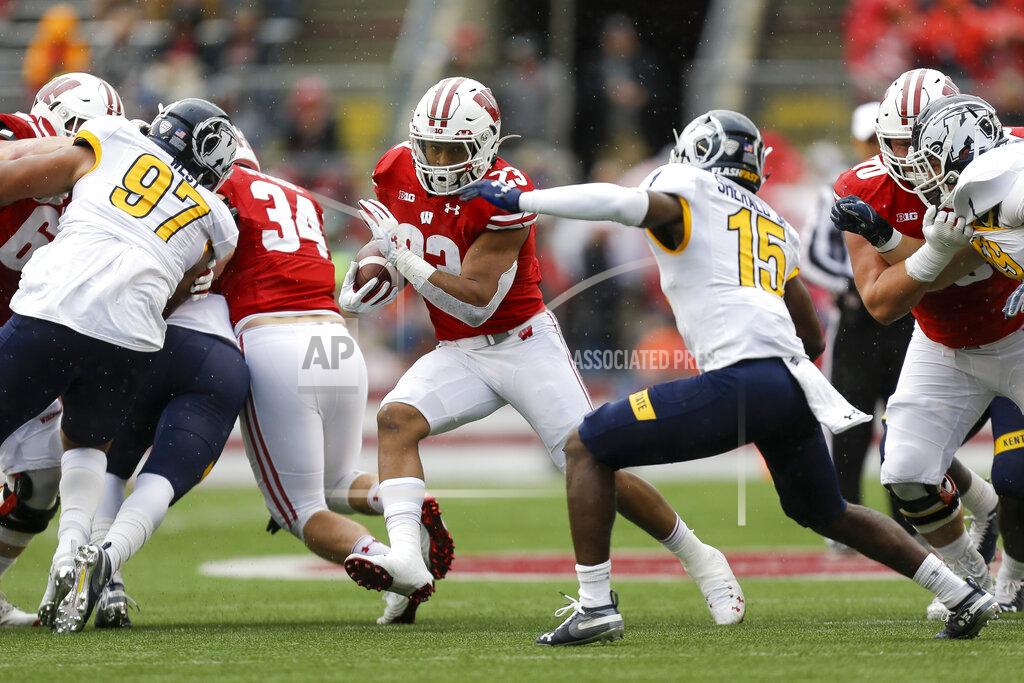 Andy Manis Wisconsin running back Jonathan Taylor (23) runs against Kent State cornerback Keith Sherald Jr. (15) during the first half of an NCAA college football game Saturday, Oct. 5, 2019, in Madison, Wis. (AP Photo/Andy Manis)