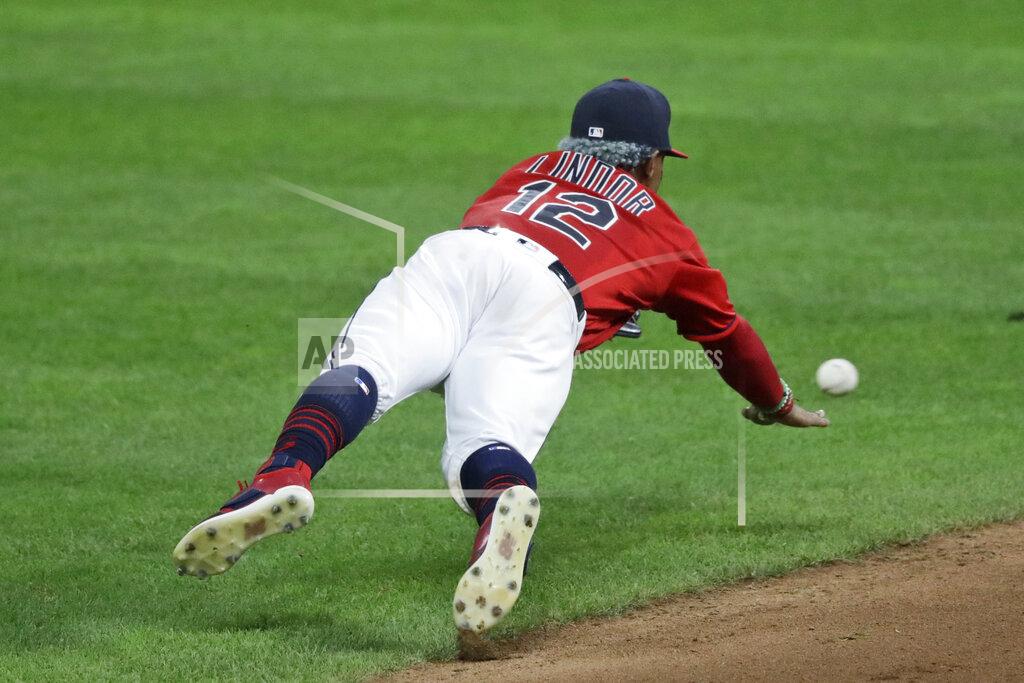 Tony Dejak Cleveland Indians' Francisco Lindor dives for a single hit by Chicago Cubs' Ian Happ in the eighth inning in a baseball game, Tuesday, Aug. 11, 2020, in Cleveland. (AP Photo/Tony Dejak)