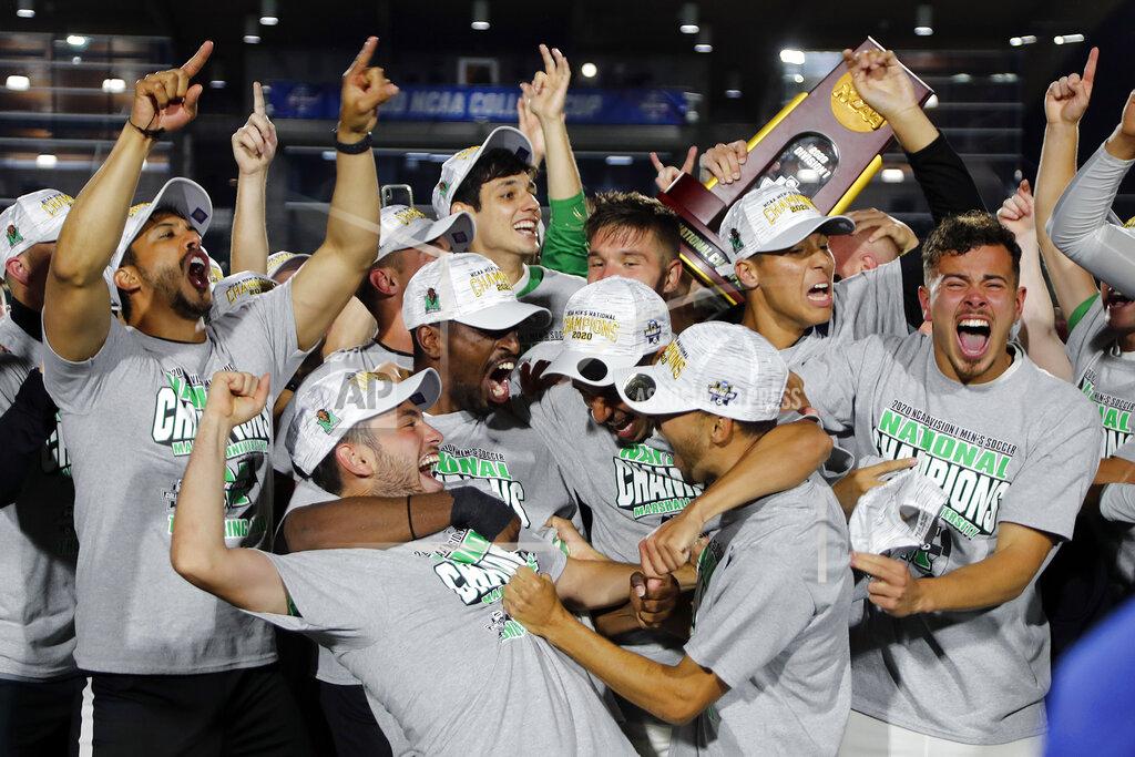 Karl B Deblaker Marshall celebrates winning the NCAA College Cup championship soccer match over Indiana in Cary, N.C., Monday, May 17, 2021. (AP Photo/Karl B DeBlaker)