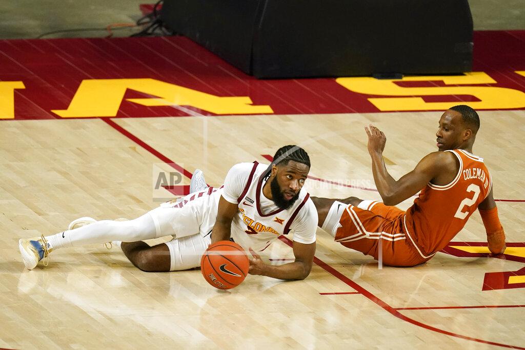 Charlie Neibergall Iowa State guard Tre Jackson, left, fights for a loose ball with Texas guard Matt Coleman III, right, during the first half of an NCAA college basketball game, Tuesday, March 2, 2021, in Ames, Iowa. (AP Photo/Charlie Neibergall)