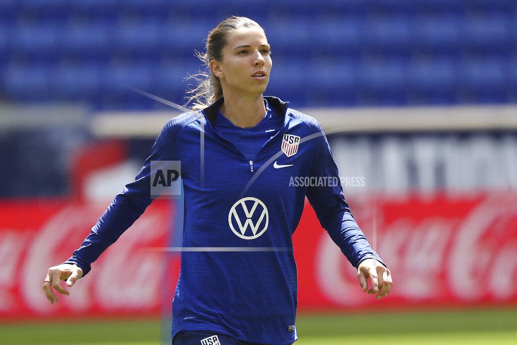 Steve Luciano FILE - In this May 25, 2019, file photo, United States forward Tobin Heath warms up during a soccer workout at Red Bull Arena, in Harrison, N.J. U.S. national team players Megan Rapinoe, Tobin Heath and Christen Press have opted out of the National Women's Soccer League tournament kicking off this weekend in Utah. Heath and Press, who played with Rapinoe on the champion World Cup team last summer in France, cited concerns about the coronavirus for their decisions not to play.(AP Photo/Steve Luciano, File)